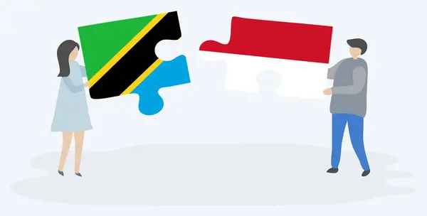 Paar Mit Zwei Puzzleteilen Mit Tansanischen Und Indonesischen Flaggen Nationale — Stockvektor