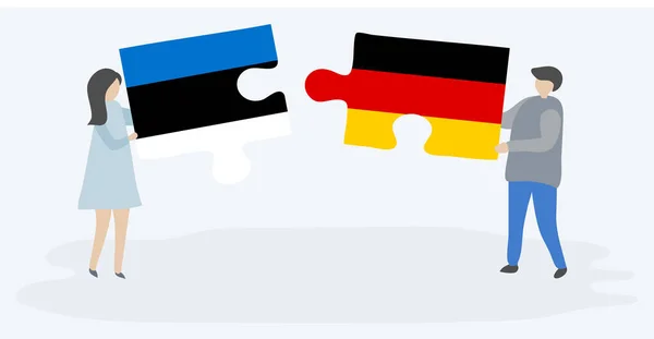 Para Trzyma Dwa Kawałki Puzzli Estońskimi Niemieckimi Flagami Estonia Niemcy — Wektor stockowy