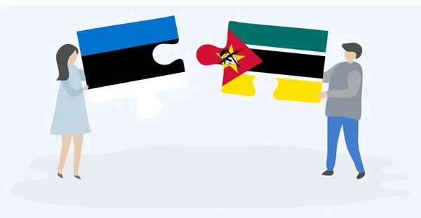 Dvojice Která Drží Dvě Skládanky Estonskými Mosambickými Vlajkami Národní Symboly — Stockový vektor