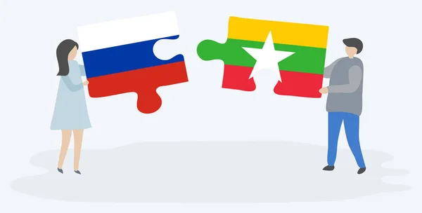 Ζευγάρι Που Κρατά Δύο Κομμάτια Παζλ Ρωσικές Και Βιρμανικές Σημαίες — Διανυσματικό Αρχείο