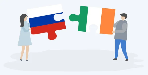 Ζευγάρι Που Κρατά Δύο Κομμάτια Παζλ Ρωσικές Και Ιρλανδικές Σημαίες — Διανυσματικό Αρχείο