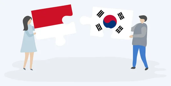 Para Trzyma Dwa Kawałki Puzzli Indonezyjskich Południowokoreańskich Flag Symbole Narodowe — Wektor stockowy