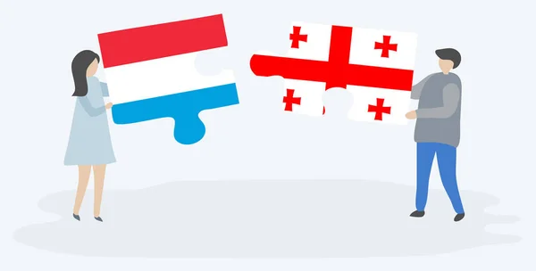 Молодята Тримають Дві Пазли Люксембурзька Грузинські Прапори Люксембург Грузія Національні — стоковий вектор