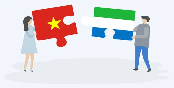 Pareja Sosteniendo Dos Piezas Rompecabezas Con Banderas Vietnamitas Sierra Leona — Vector de stock