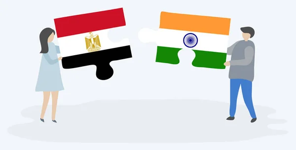 エジプトとインドの旗を持つ2つのパズルのピースを保持しているカップル エジプトとインドのシンボルが一緒に — ストックベクタ