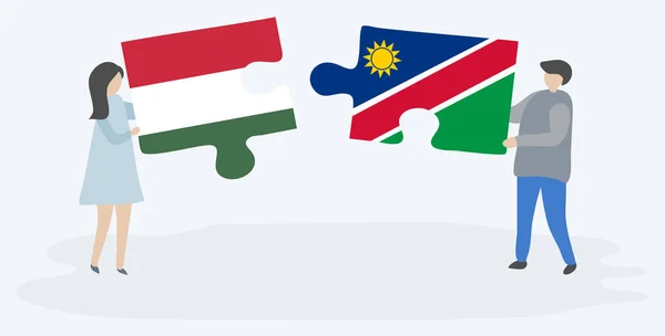 Pareja Sosteniendo Dos Piezas Rompecabezas Con Banderas Húngaras Namibias Hungría — Vector de stock