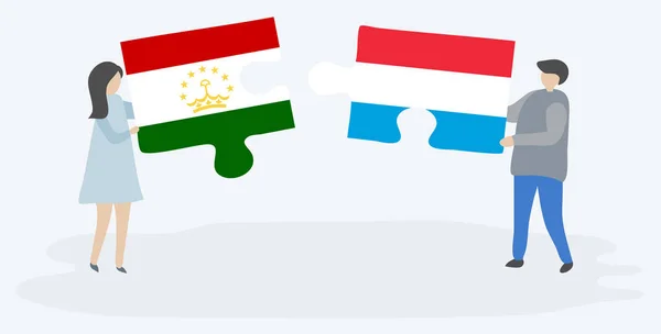 Paar Houden Twee Puzzels Stukken Met Tajikistani Luxemburgse Vlaggen Nationale — Stockvector