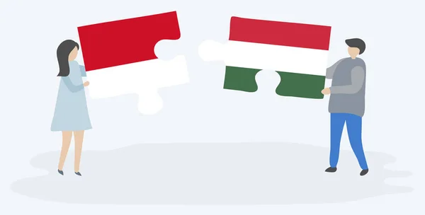 Ζευγάρι Που Κρατά Δύο Κομμάτια Παζλ Ινδονησιακή Και Ουγγρική Σημαίες — Διανυσματικό Αρχείο