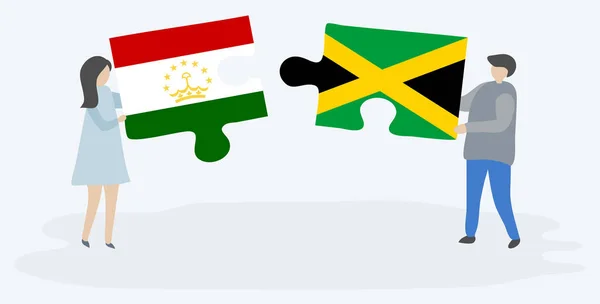 Pareja Sosteniendo Dos Piezas Rompecabezas Con Banderas Tayikistán Jamaica Tayikistán — Vector de stock