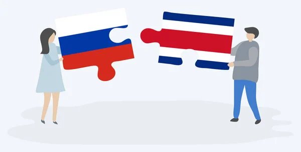 Ζευγάρι Που Κρατά Δύο Κομμάτια Παζλ Σημαίες Της Ρωσίας Και — Διανυσματικό Αρχείο