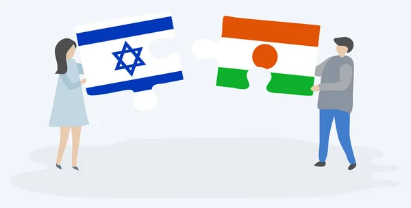 Dvojice Drží Dvě Skládanky Vlajkami Izraele Nigerien Národní Symboly Izraele — Stockový vektor