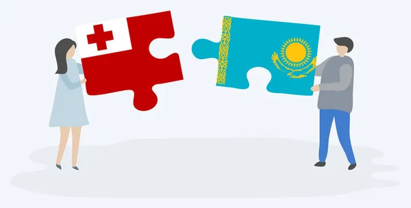 Couple Tenant Deux Pièces Puzzles Avec Des Drapeaux Tongan Kazakh — Image vectorielle