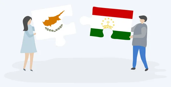 キプロスとタジキスタンの旗を持つ2つのパズルピースを保持しているカップル キプロスとタジキスタンの国のシンボル — ストックベクタ