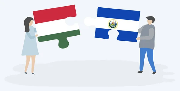 ハンガリーとサルバドラの旗を持つ2つのパズルのピースを保持しているカップル ハンガリーとエルサルバドルのシンボル — ストックベクタ