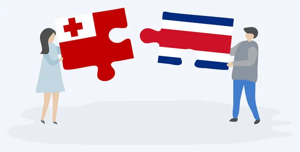 Para Trzyma Dwa Kawałki Puzzli Tongan Kostarykańskie Flagi Tonga Kostaryka — Wektor stockowy