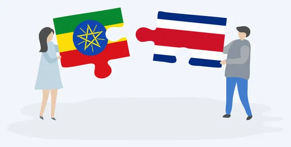 Casal Segurando Duas Peças Quebra Cabeças Com Bandeiras Etíopes Costa —  Vetores de Stock