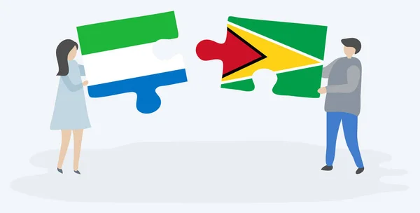 Pareja Sosteniendo Dos Piezas Rompecabezas Con Banderas Sierra Leona Guyana — Vector de stock