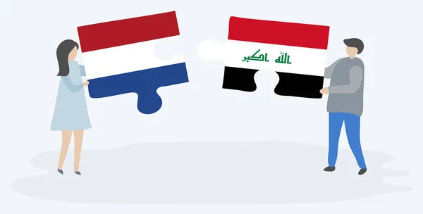 オランダとイラクの旗を持つ2つのパズルのピースを保持しているカップル オランダとイラクの国のシンボル — ストックベクタ