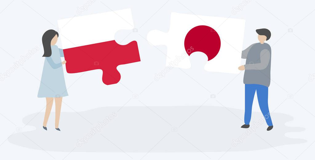 Couple holding two puzzles pieces with Polish and Japanese flags. Poland and Japan national symbols together.