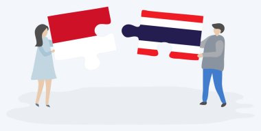 Çift Endonezya ve Tay bayrakları ile iki bulmaca parçaları tutan. Endonezya ve Tayland ulusal sembolleri birlikte.