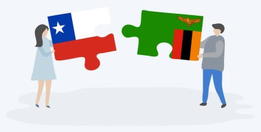 Şili ve Zambiya bayrakları ile iki bulmaca parçaları tutan çift. Şili ve Zambiya ulusal sembolleri birlikte.