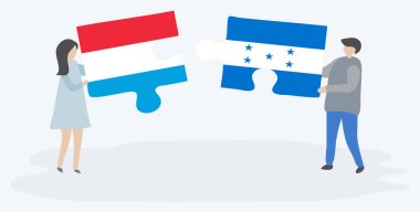 Lüksemburg ve Honduras bayrakları ile iki bulmaca parçaları tutan çift. Lüksemburg ve Honduras ulusal sembolleri birlikte.