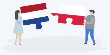 Hollanda ve Polonya bayrakları ile iki bulmaca parçaları tutan çift. Hollanda ve Polonya ulusal sembolleri birlikte.