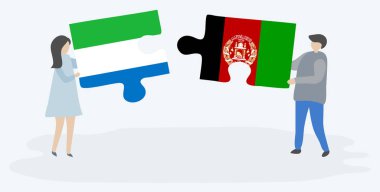 Sierra Leonean ve Afgan bayrakları ile iki bulmaca parçaları tutan çift. Sierra Leone ve Afganistan ulusal sembolleri birlikte.