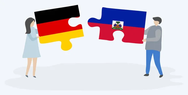 Pareja Sosteniendo Dos Piezas Rompecabezas Con Banderas Alemanas Haitianas Alemania — Archivo Imágenes Vectoriales