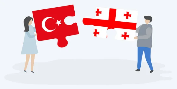 一对夫妇拿着两个拼图片与土耳其和格鲁吉亚国旗 土耳其和格鲁吉亚国家符号在一起 — 图库矢量图片