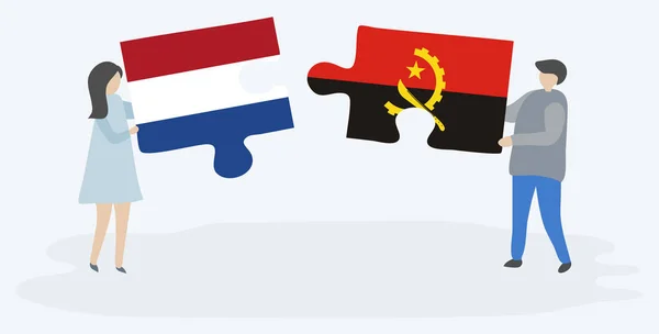 Paar Houden Twee Puzzels Stukken Met Nederlandse Angolese Vlaggen Nederland — Stockvector