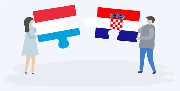 Casal Segurando Duas Peças Quebra Cabeças Com Bandeiras Luxemburguesas Croatas — Vetor de Stock