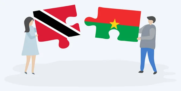 Casal Segurando Duas Peças Quebra Cabeças Com Bandeiras Trinidadian Burkinabe —  Vetores de Stock