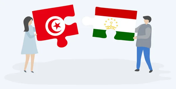 Casal Segurando Duas Peças Quebra Cabeças Com Bandeiras Tunisianas Tajiquistanesas —  Vetores de Stock