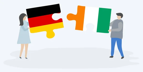 Couple Tenant Deux Pièces Puzzles Avec Des Drapeaux Allemands Ivoiriens — Image vectorielle