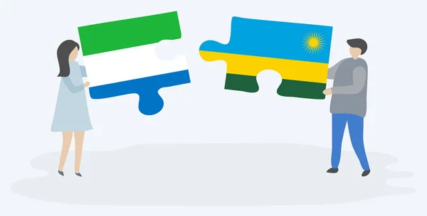 Sierra Leone Ruanda Bayrakları Ile Iki Bulmaca Parçaları Tutan Çift — Stok Vektör