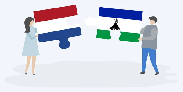 Pasangan Yang Memegang Dua Buah Teka Teki Dengan Bendera Belanda - Stok Vektor