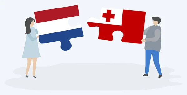Paar Houden Twee Puzzels Stukken Met Nederlandse Tongaanse Vlaggen Nederland — Stockvector