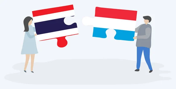 Pareja Sosteniendo Dos Piezas Rompecabezas Con Banderas Tailandesas Luxemburguesas Tailandia — Archivo Imágenes Vectoriales