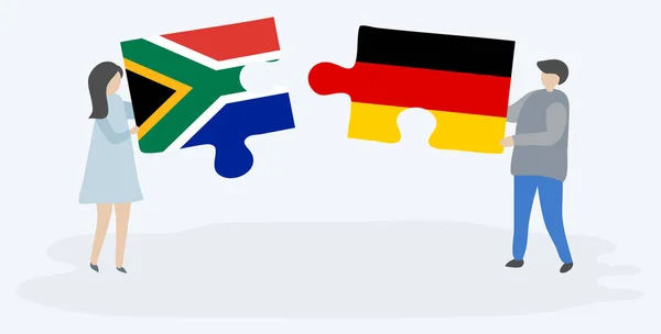 Çift Güney Afrika Alman Bayrakları Ile Iki Bulmaca Parçaları Tutan — Stok Vektör