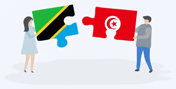 Couple Tenant Deux Pièces Puzzles Avec Des Drapeaux Tanzaniens Tunisiens — Image vectorielle