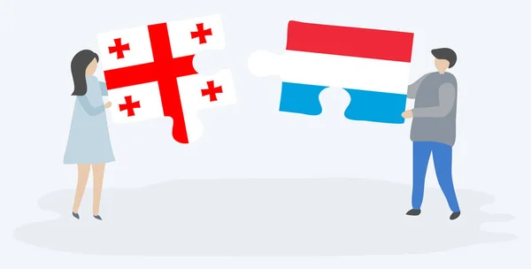 Casal Segurando Duas Peças Quebra Cabeças Com Bandeiras Georgianas Luxemburguesas — Vetor de Stock