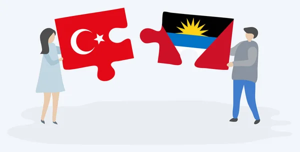 Türk Antiguan Bayrakları Ile Iki Bulmaca Parçaları Tutan Çift Türkiye — Stok Vektör