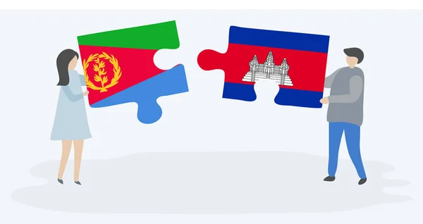 Para Trzyma Dwa Kawałki Puzzli Erytrean Kambodży Flagi Erytrea Kambodża — Wektor stockowy