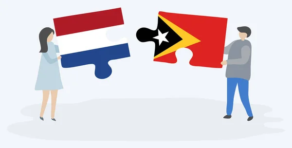 Ζευγάρι Που Κρατά Δύο Κομμάτια Παζλ Τις Σημαίες Του Ολλανδικού — Διανυσματικό Αρχείο
