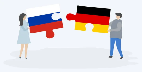 Paar Mit Zwei Puzzleteilen Mit Russischer Und Deutscher Flagge Russland — Stockvektor