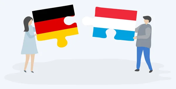 Pareja Sosteniendo Dos Piezas Rompecabezas Con Banderas Alemanas Luxemburguesas Alemania — Vector de stock