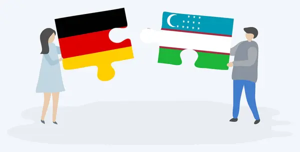 Couple Holding Two Puzzles Pieces German Uzbek Flags Germany Uzbekistan — Stock Vector