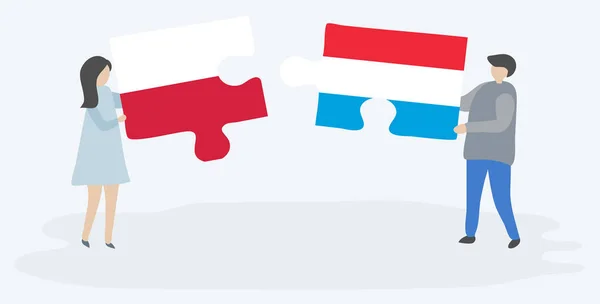 Para Trzyma Dwa Puzzle Kawałki Polskich Luksemburskie Flagi Polskie Luksemburskie — Wektor stockowy