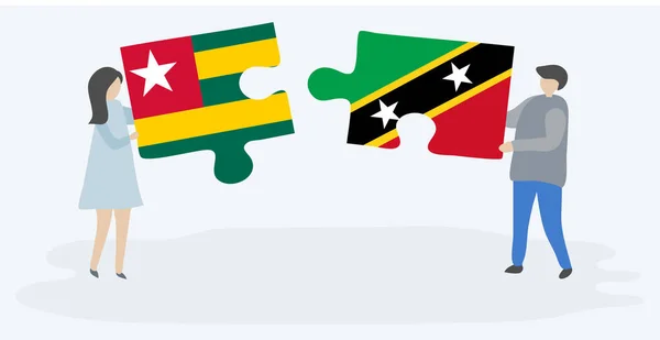 Pareja Sosteniendo Dos Piezas Rompecabezas Con Banderas Togolesas Kittitianas Togo — Vector de stock